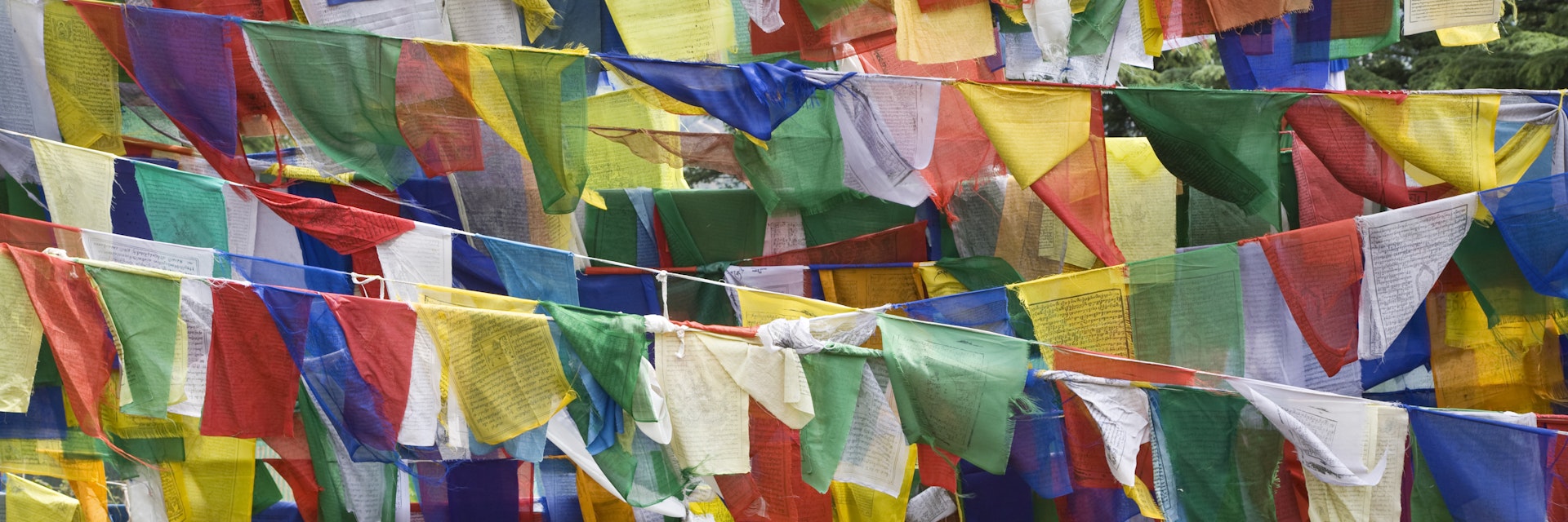 Tibetan Prayer Flags Fly On The Grounds Of The Tsuglagkhang Complex Which Is The Dalai Lamas Residence In Exile In McLeod Gang, Dharmsala, India