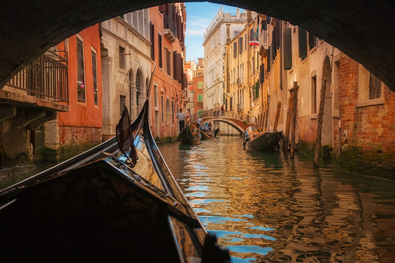 Italy, Veneto, Venice, Gondola under bridge