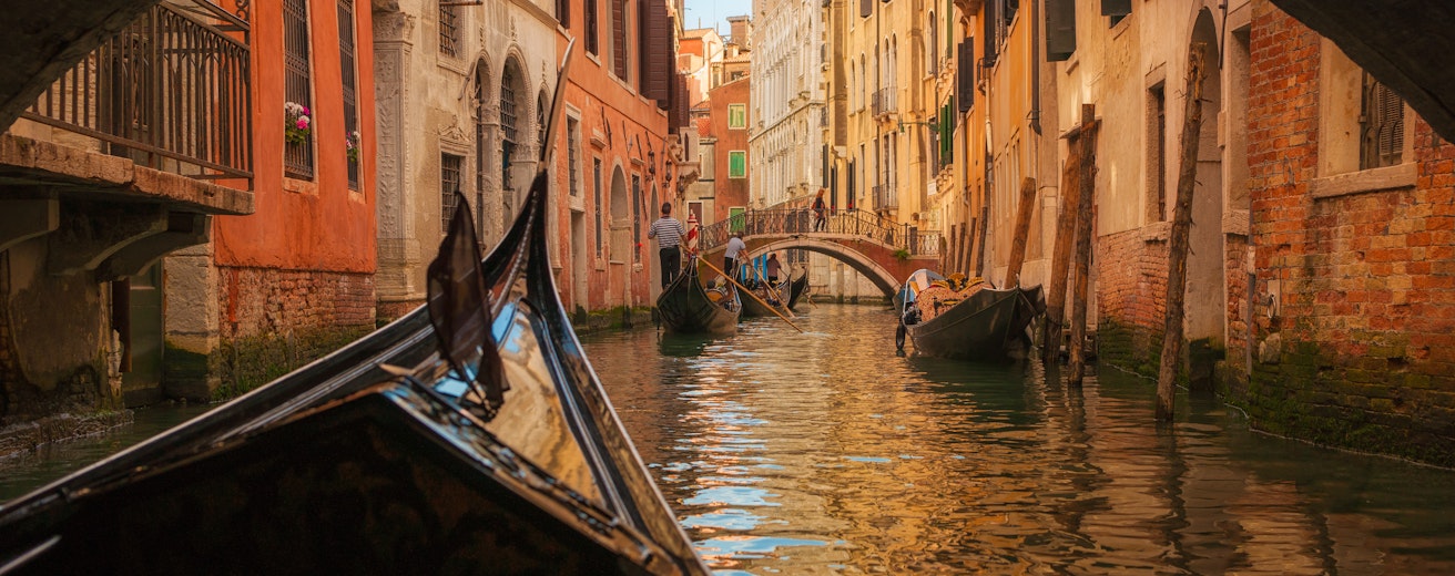 Italy, Veneto, Venice, Gondola under bridge