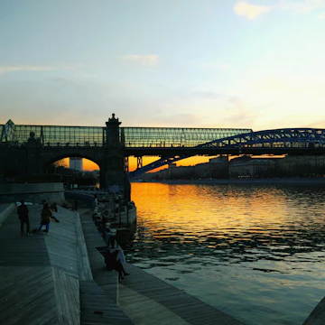Bridge Over River Against Sky During Sunset