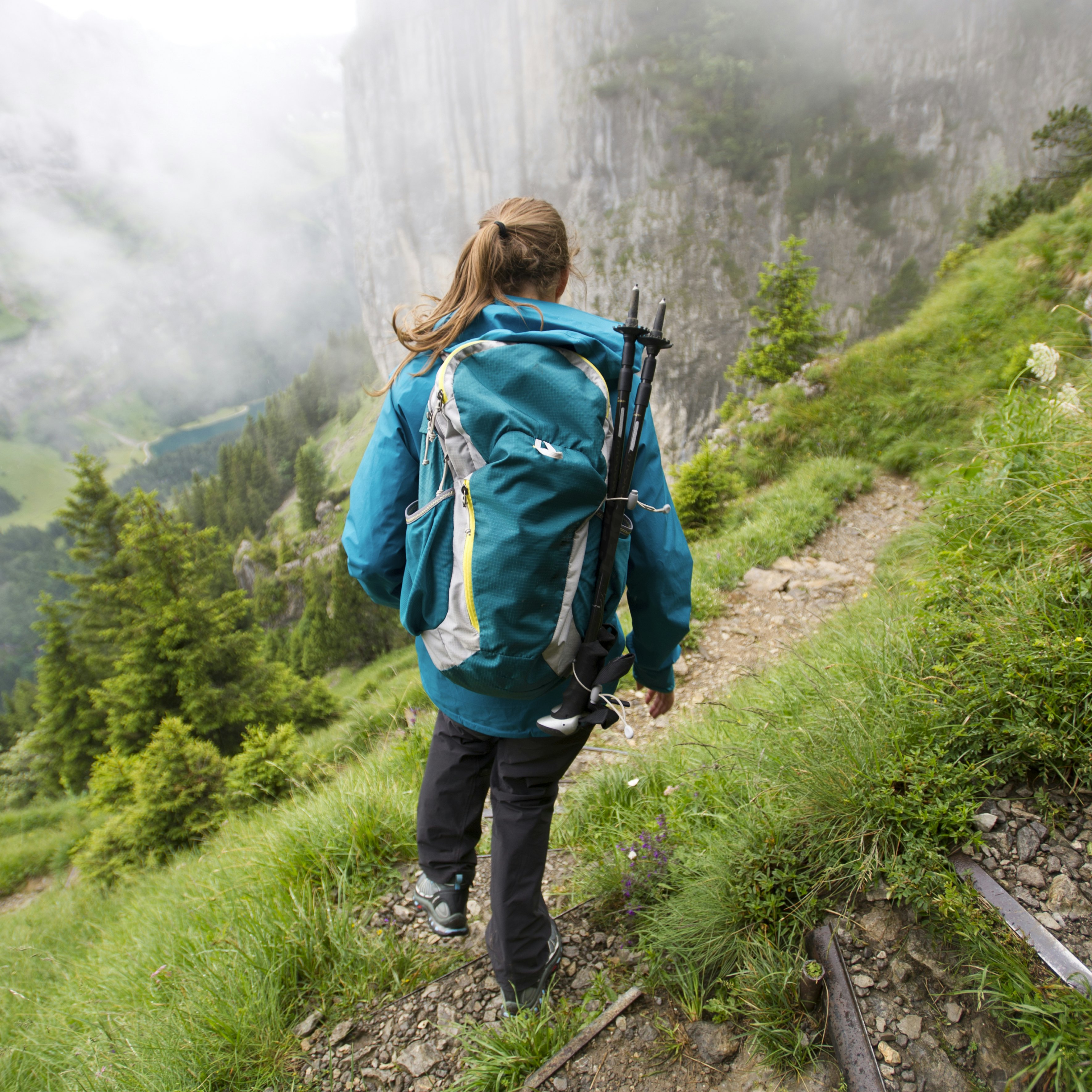 Woman hiking, Appenzellerland, Switzerland.