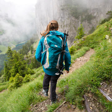 Woman hiking, Appenzellerland, Switzerland.