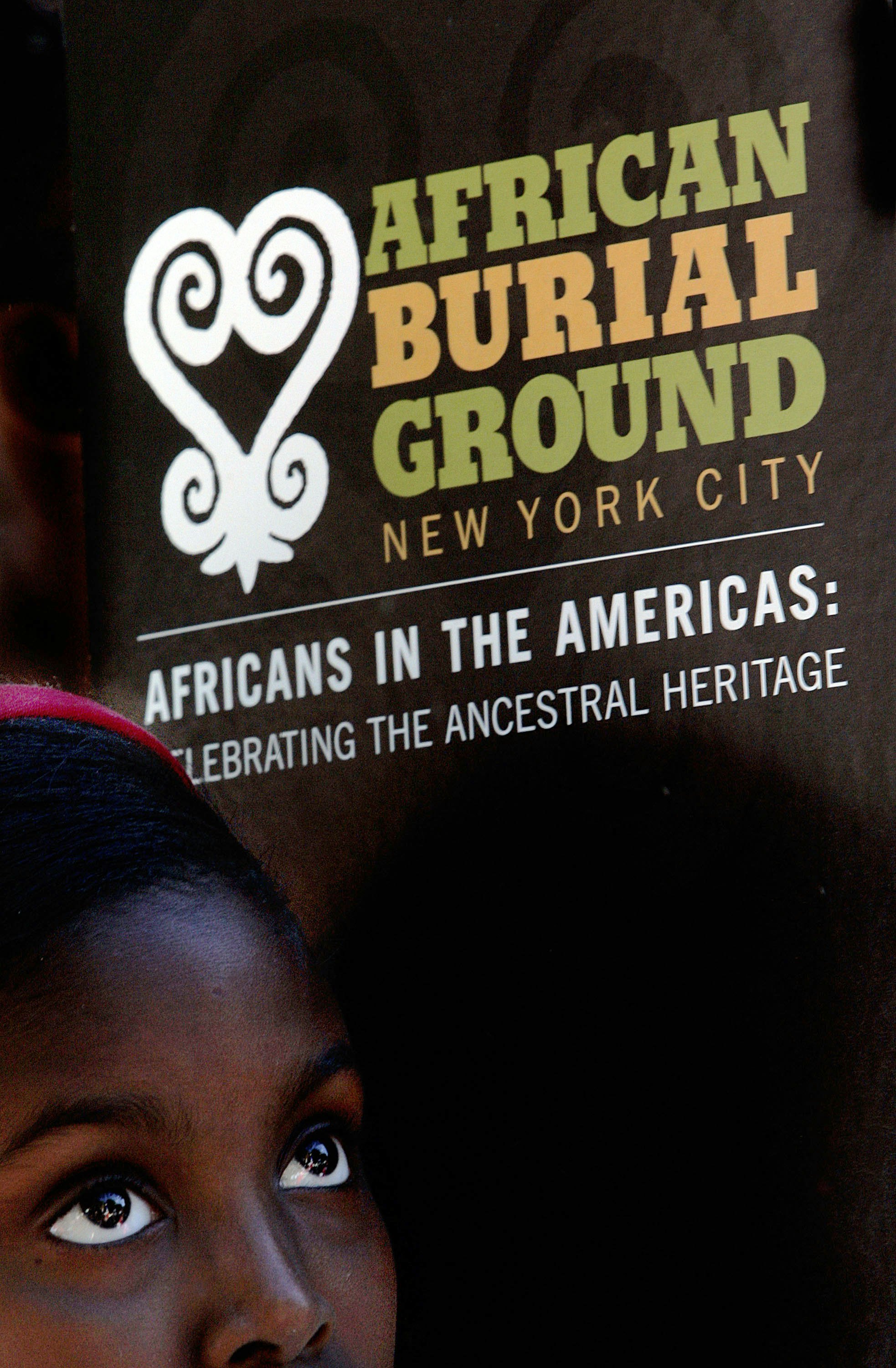 NEW YORK - SEPTEMBER 30: A school child listens to a speaker during a ceremony at the African Burial Ground September 30, 2005 in New York City. Hundreds of school children attended the tribute ceremony at the African Burial Ground, a final resting place for slaves that settled in New York City. The burial ground was dedicated in October 2003. (Photo by Stephen Chernin/Getty Images)