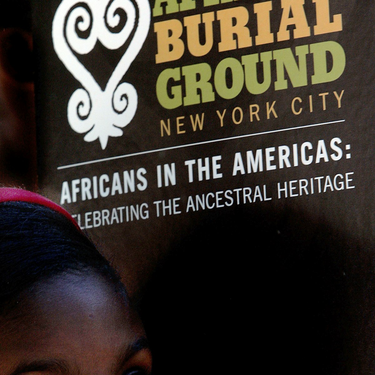 NEW YORK - SEPTEMBER 30: A school child listens to a speaker during a ceremony at the African Burial Ground September 30, 2005 in New York City. Hundreds of school children attended the tribute ceremony at the African Burial Ground, a final resting place for slaves that settled in New York City. The burial ground was dedicated in October 2003. (Photo by Stephen Chernin/Getty Images)