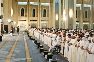 Ramadan prayer at Grand Mosque of Kuwait at night , Kuwait City, Kuwait.