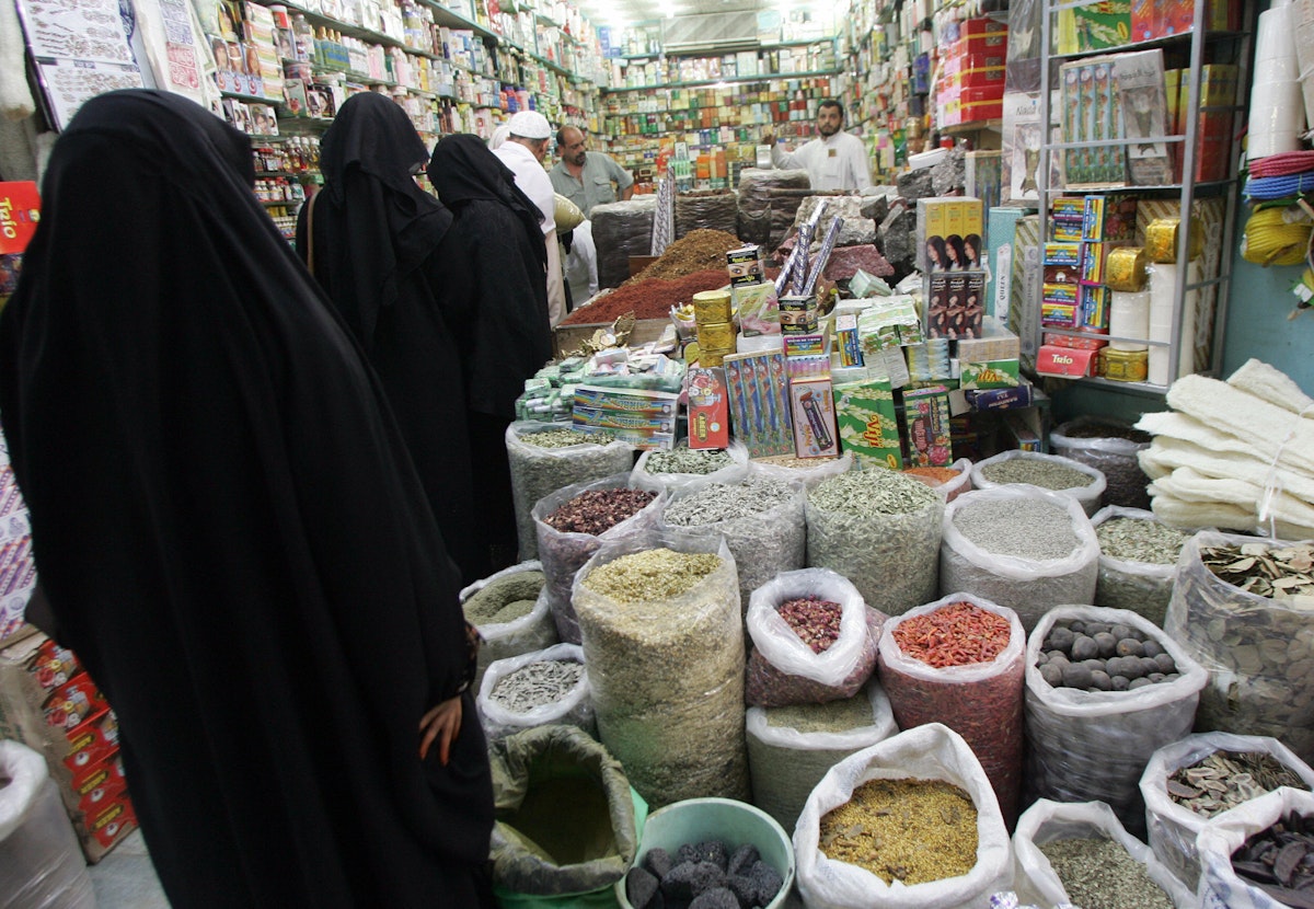 Jeddah, SAUDI ARABIA:  Saudi women shop at a grocery in the Souq al-Alawi market in the old town of Jeddah 29 December 2005. The market is the biggest market in Saudi Arabia where hundreds of thousands of Muslims from different countries have so far arrived for the annual pilgrimage to Mecca which begins on January 7. AFP PHOTO/BEHROUZ MEHRI  (Photo credit should read BEHROUZ MEHRI/AFP/Getty Images)