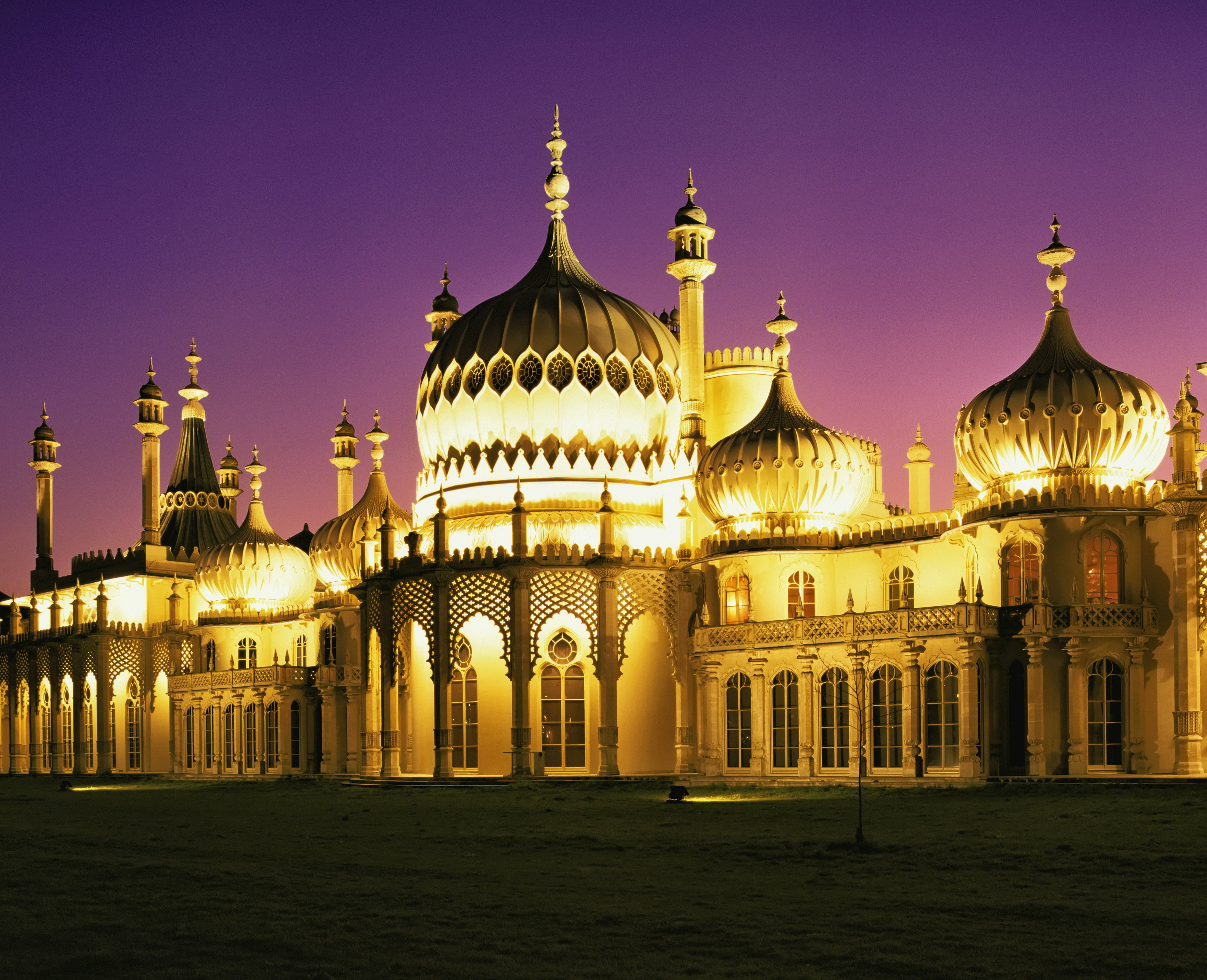 Illuminated Brighton Pavilion building at dusk, Brighton, Sussex, United Kingdom