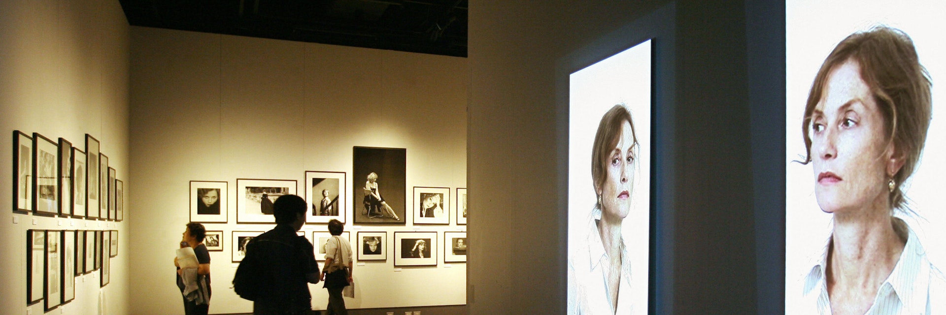 Tokyo, JAPAN:  Video portraits and photographs of French actress Isabelle Huppert are dispayed during a press preview of a photo exhibition "Woman of Many Faces" at the Tokyo Metropolitan Museum of Photography, 30 June 2006. Over 100 photographic and video portraits by legendary artists, including Henri Cartier-Bresson, Richard Avedon, Helmut Newton, will be held a montly exhibition until 06 August.  AFP PHOTO/Kazuhiro NOGI    (Photo credit should read KAZUHIRO NOGI/AFP/Getty Images)