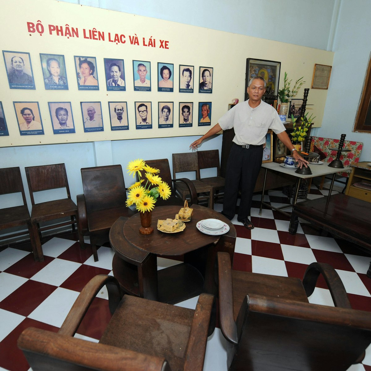 TO GO WITH: VIETNAM-MILITARY-TET-OFFENSIVE by Franck ZELLER.Ngo Van Lap, son of Pho Binh restaurant's owner Ngo Toai, a Viet Cong agent, shows in Ho Chi Minh-City, 28 January 2008, the meeting room in the restaurant where was ordered the start of the Vietnam War's Tet 1968 offensive.    AFP PHOTO/HOANG DINH Nam (Photo credit should read HOANG DINH NAM/AFP/Getty Images)