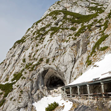 Austria, Werfen, Eisriesenwelt, snow covered building in front of cave