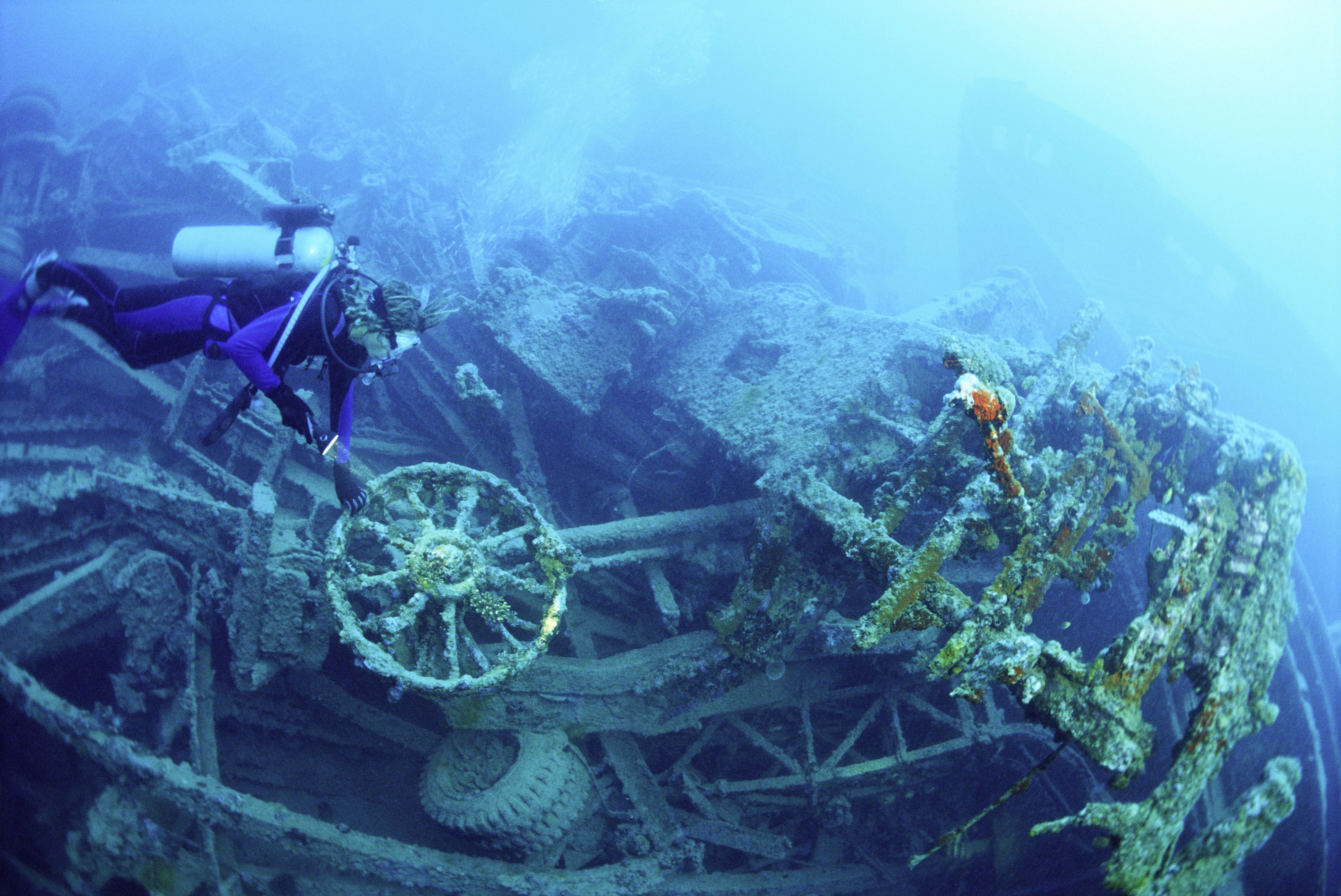 Scuba diver underwater at Million Dollar Point, Vanuatu