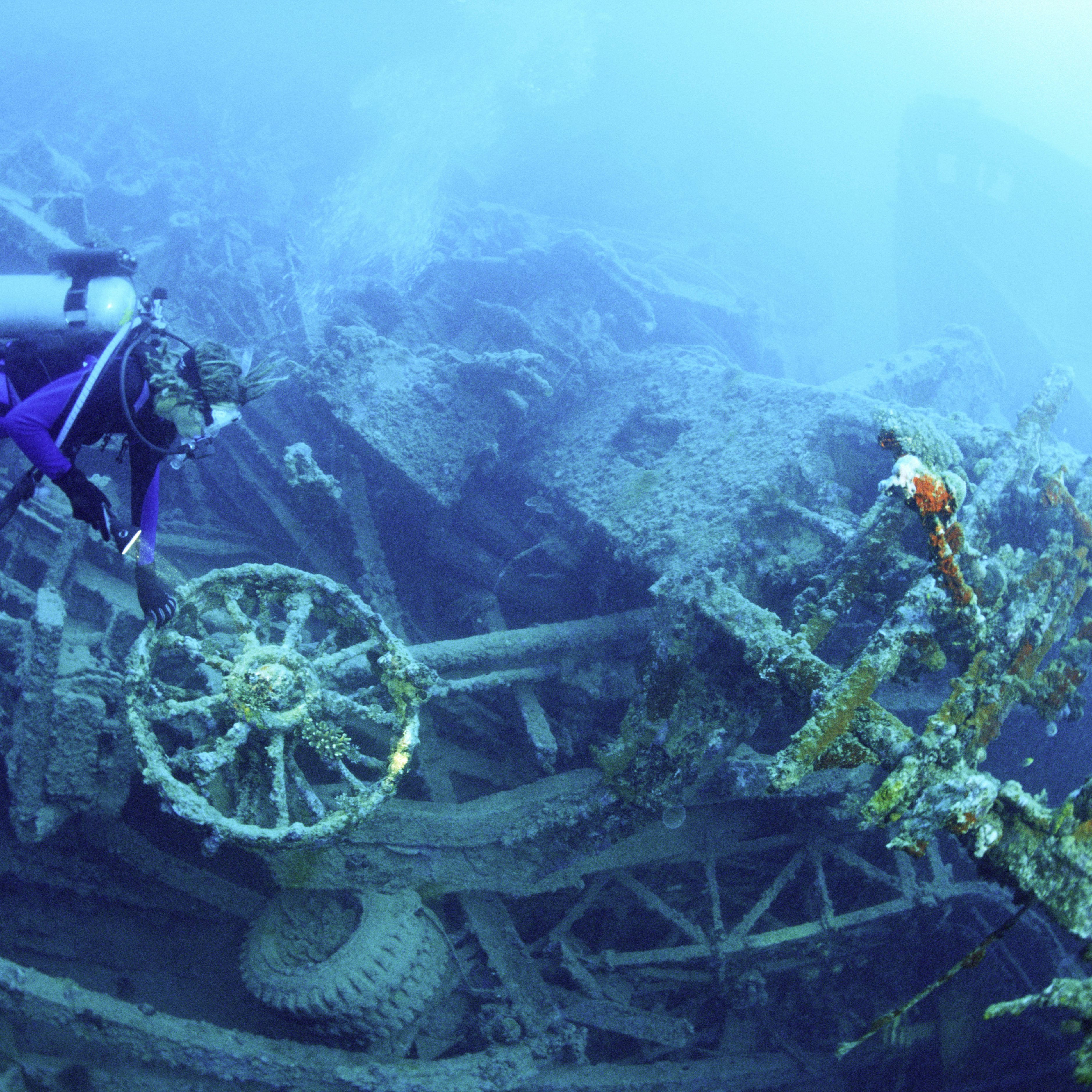 Scuba diver underwater at Million Dollar Point, Vanuatu