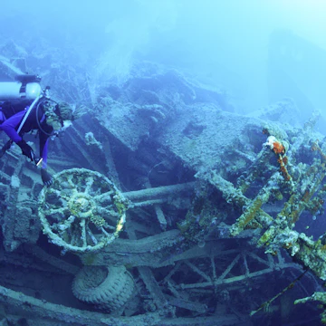 Scuba diver underwater at Million Dollar Point, Vanuatu