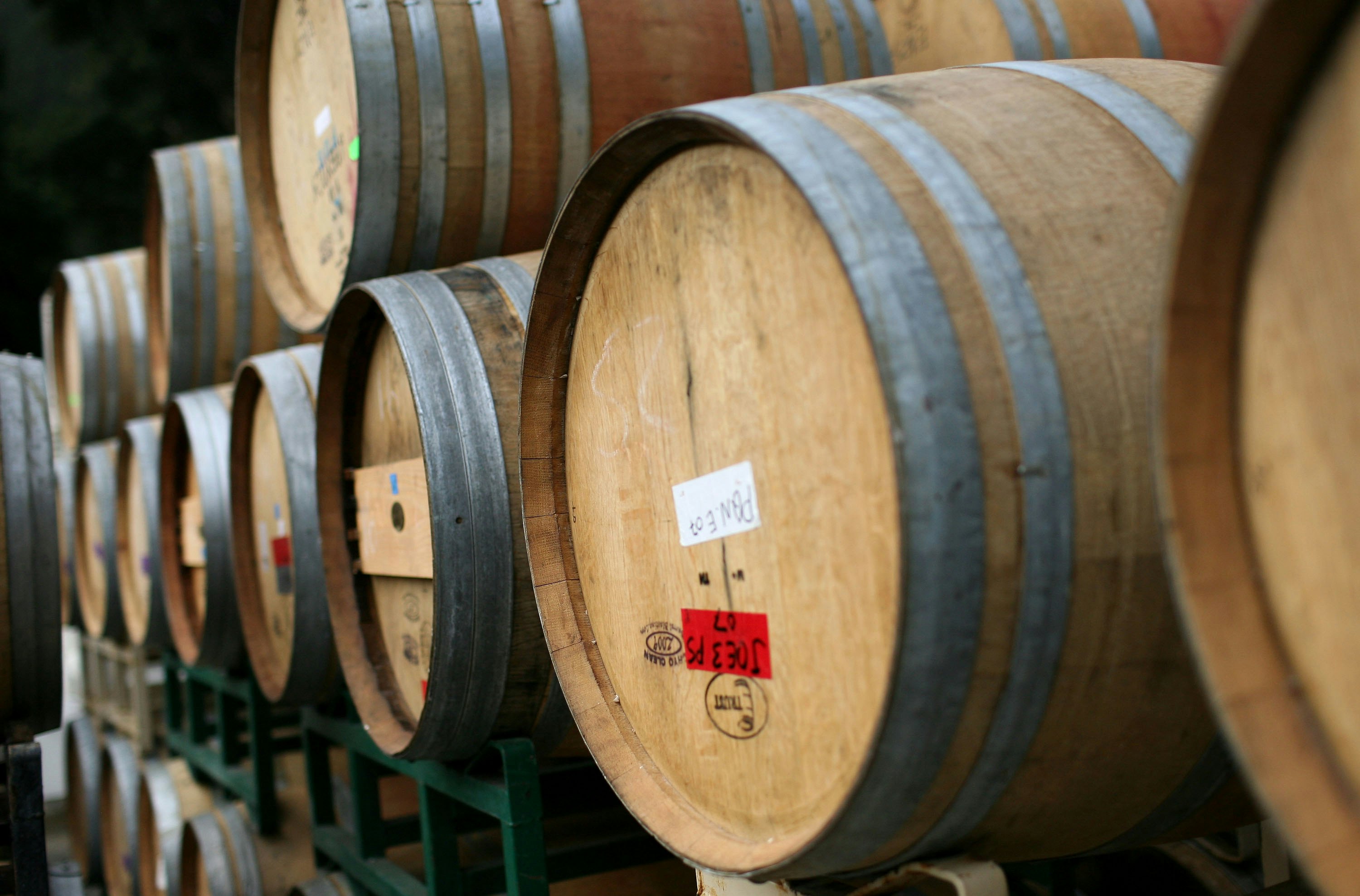 ST. HELENA, CA - SEPTEMBER 25: Rows of oak wine barrels sit on racks at Tres Sabores Winery September 25, 2009 in St. Helena, California. Tres Sabores, a certified organic winery, has strated to harvest their grapes for the 2009 vintage as wineries throughout the Napa and Sonoma Valleys begin to harvest and crush grapes.  (Photo by Justin Sullivan/Getty Images)