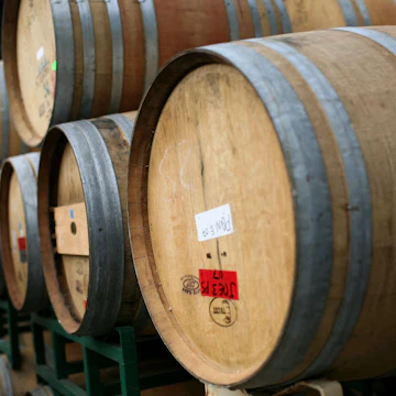 ST. HELENA, CA - SEPTEMBER 25: Rows of oak wine barrels sit on racks at Tres Sabores Winery September 25, 2009 in St. Helena, California. Tres Sabores, a certified organic winery, has strated to harvest their grapes for the 2009 vintage as wineries throughout the Napa and Sonoma Valleys begin to harvest and crush grapes. (Photo by Justin Sullivan/Getty Images)