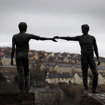 DERRY, NORTHERN IRELAND - MARCH 15: The Hands Across The Divide statue is silhouetted againts the sky on March 15, 2010 in Derry, Northern Ireland. The Bloody Sunday Inquiry chaired by Lord Saville was established in 1998 to look at the shooting dead of 14 civil rights marchers by the British Army in Derry, Northern Ireland on January 30, 1972. Lord Saville and his fellow judges have spoken to 921 witnesses during the longest legal proceedings in British and Irish history. Their report is due to be sent to the Government by the end of March 2010. (Photo by Peter Macdiarmid/Getty Images)
