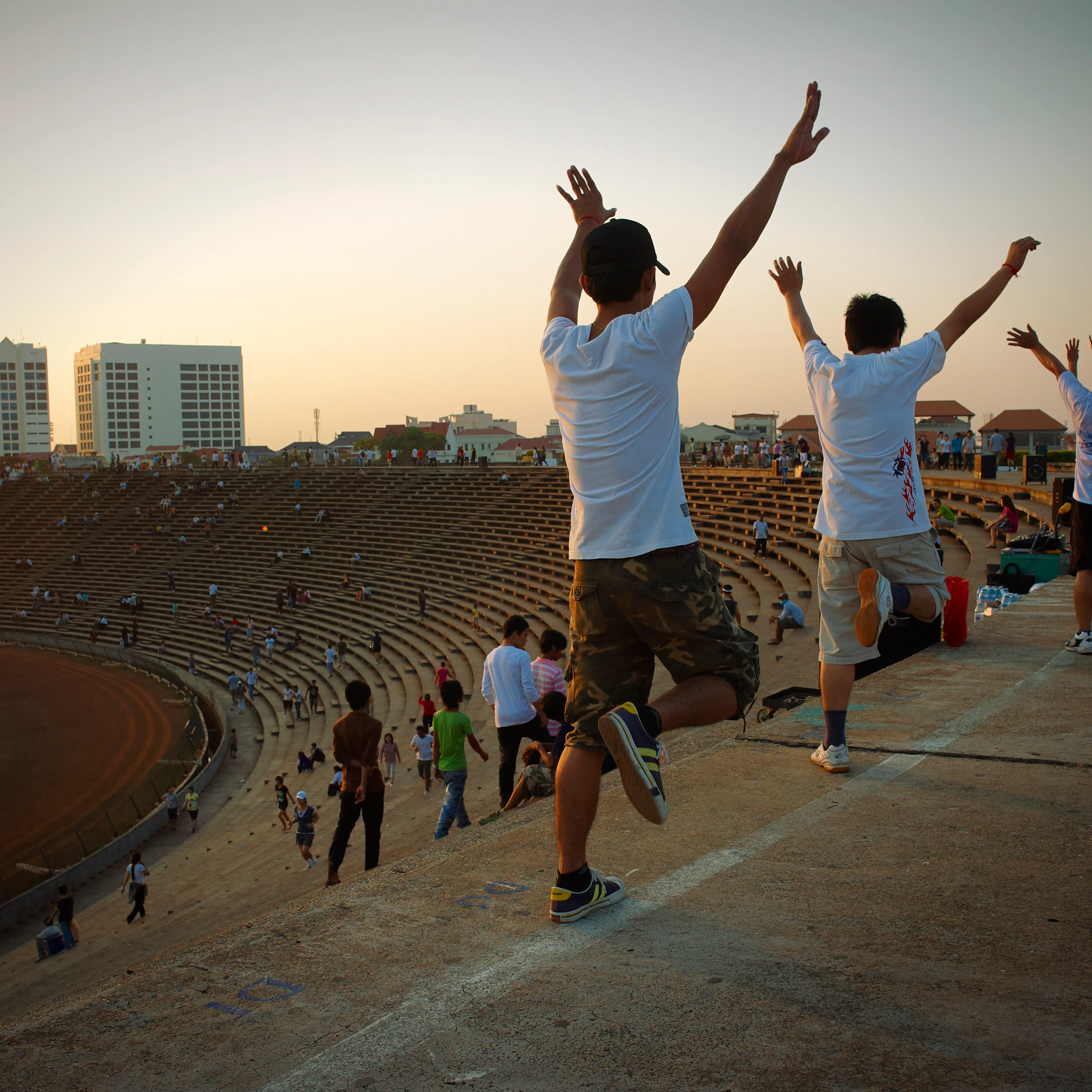 Cambodia, Phnom Penh, Olympic Stadium, popular sports on Sunday. The fastest changing capital city in south east Asia, in it's way of life more then in architectural features. Trendy shops, boutique hotels, colonial restaurants make a new image of the Khmer city. But many shadows and contrasts are left behind, and you can easily see them on the sidewalks.