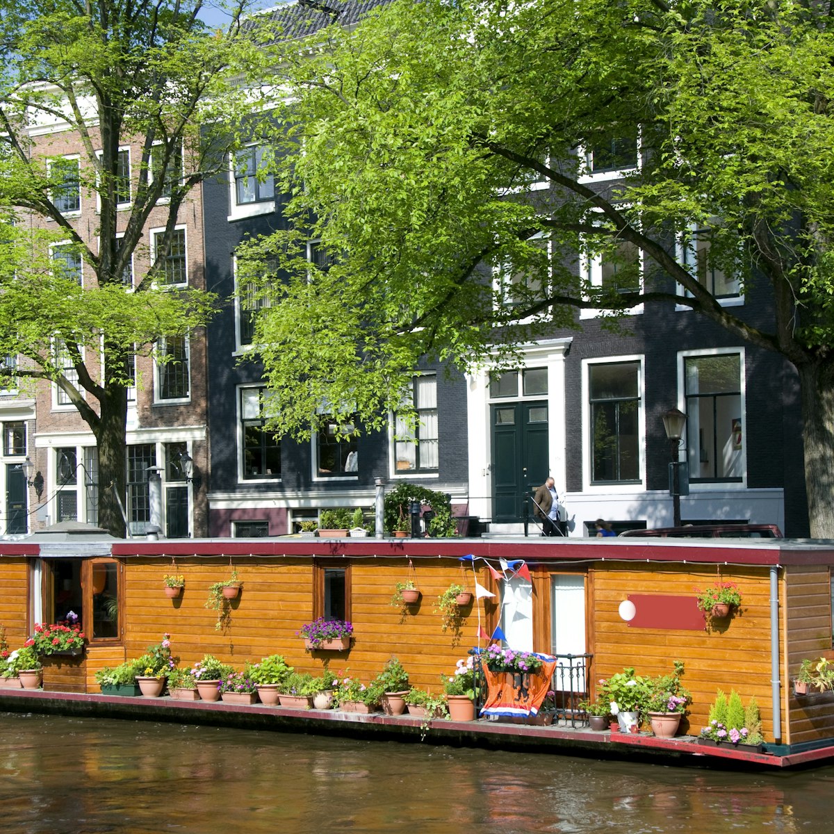 amsterdam holland canal house boat with flowers