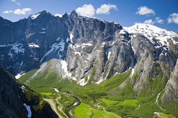 Rock face of the Trollveggen above lush green valleys.