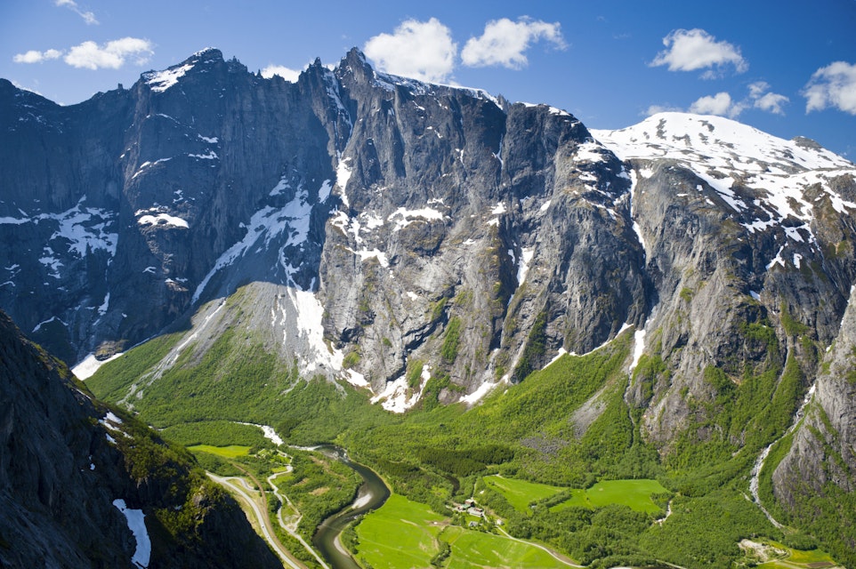 Rock face of the Trollveggen above lush green valleys.