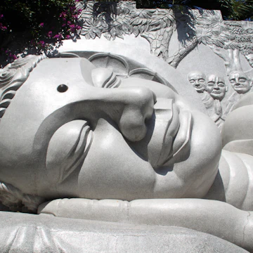 Head of sleeping white Buddha on the hill in Nha Trang, Vietnam; Shutterstock ID 59127226; Your name (First / Last): Josh Vogel; GL account no.: 56530; Netsuite department name: Online Design; Full Product or Project name including edition: Digital Content/Sights