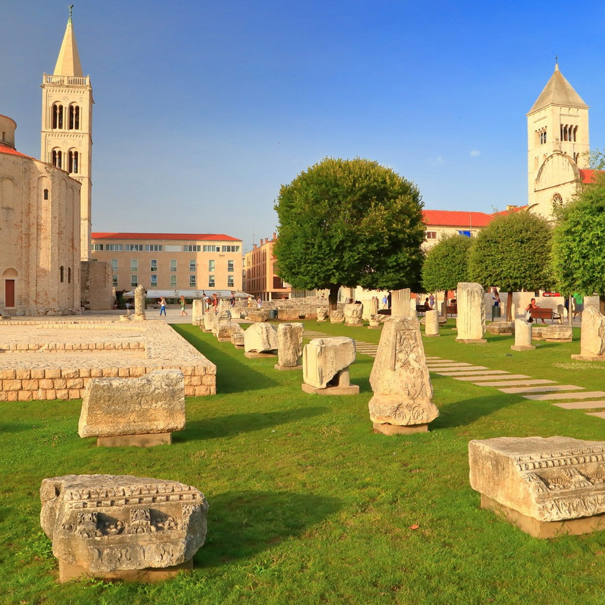 Roman forum and distant church inside old Venetian town, Zadar, Croatia; Shutterstock ID 218654365; Your name (First / Last): Emma Sparks; GL account no.: 65050; Netsuite department name: Online Editorial; Full Product or Project name including edition: Best in Europe POI updates