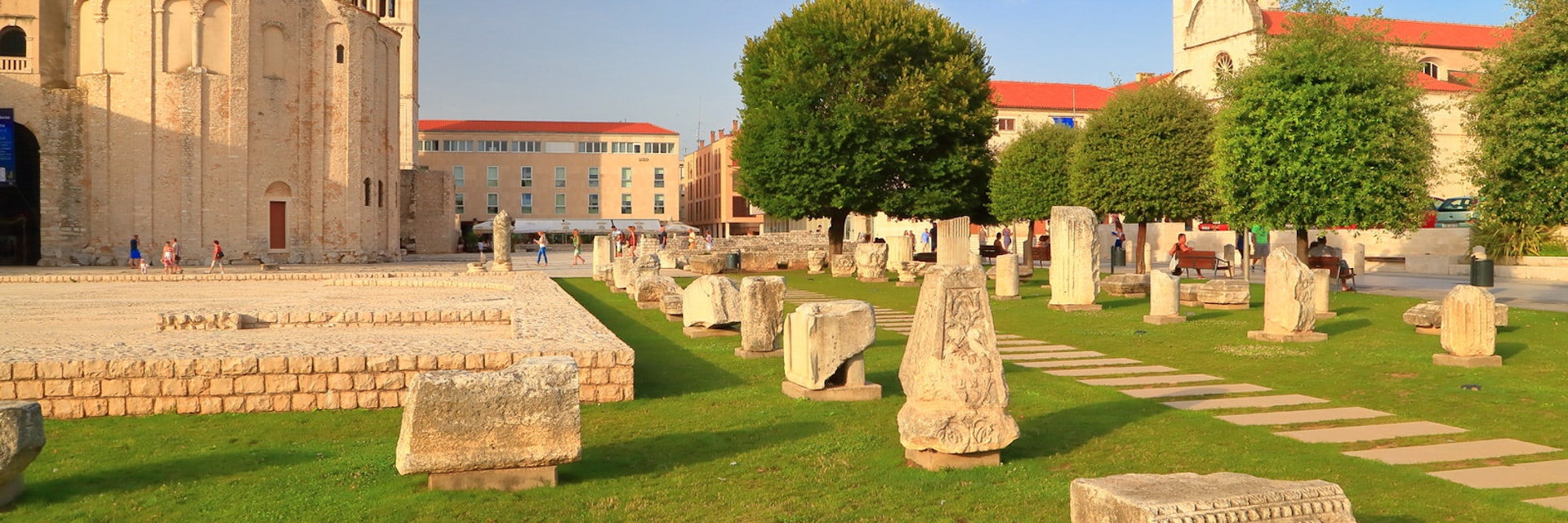Roman forum and distant church inside old Venetian town, Zadar, Croatia; Shutterstock ID 218654365; Your name (First / Last): Emma Sparks; GL account no.: 65050; Netsuite department name: Online Editorial; Full Product or Project name including edition: Best in Europe POI updates