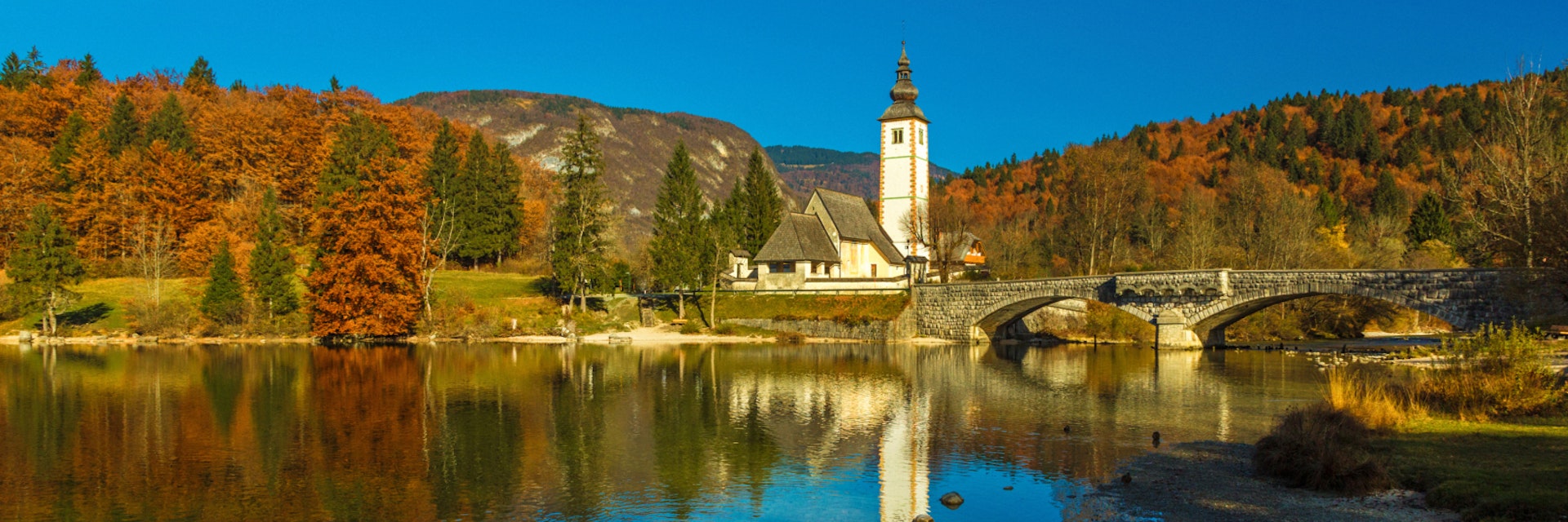 The Church of St. John the Baptist (sv. Janez Krstnik) in Ribcev Laz at the shore of Lake Bohinj, Slovenia.