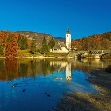 The Church of St. John the Baptist (sv. Janez Krstnik) in Ribcev Laz at the shore of Lake Bohinj, Slovenia.