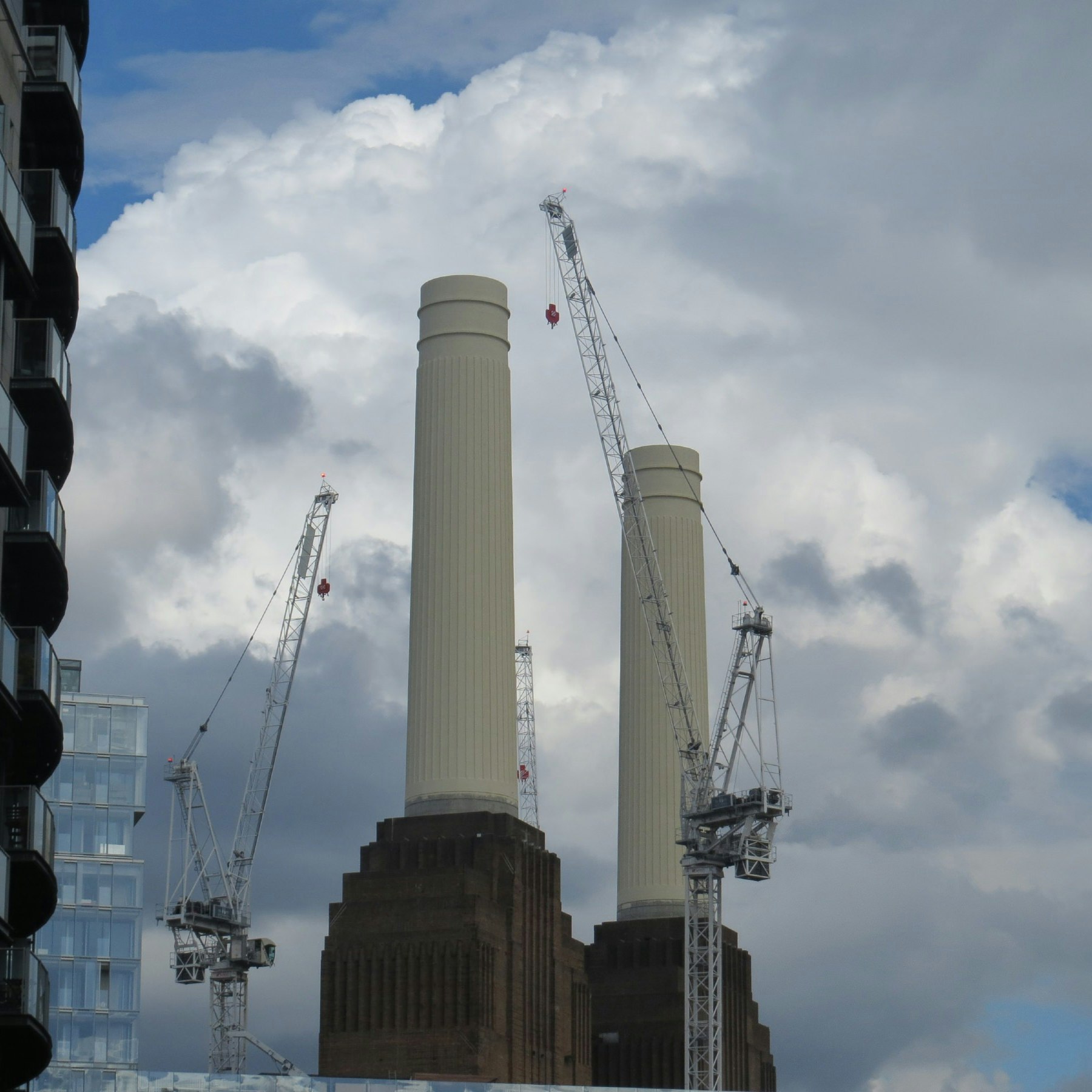 Battersea Power Station chimneys seen between two buildings