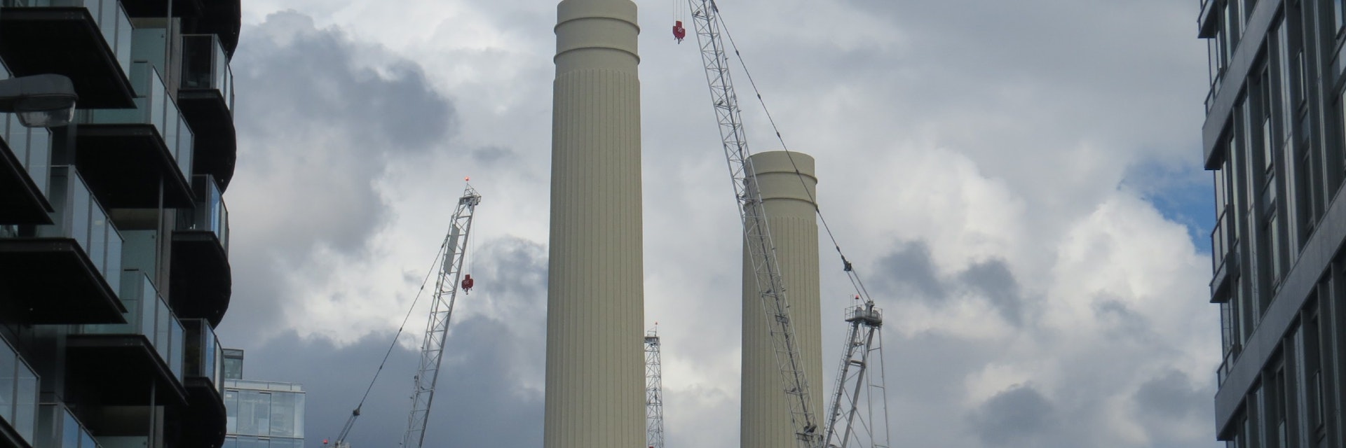Battersea Power Station chimneys seen between two buildings