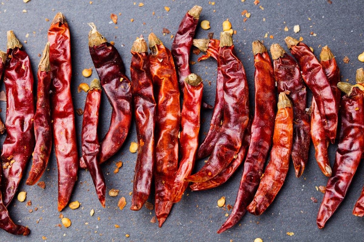 500px Photo ID: 158306929 - Dried red chili peppers on slate background Top view Copy space.