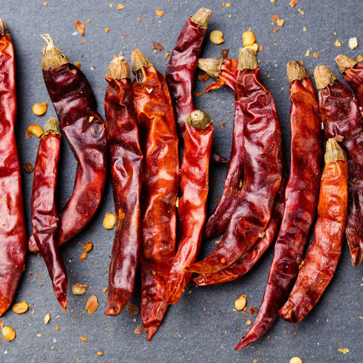 500px Photo ID: 158306929 - Dried red chili peppers on slate background Top view Copy space.