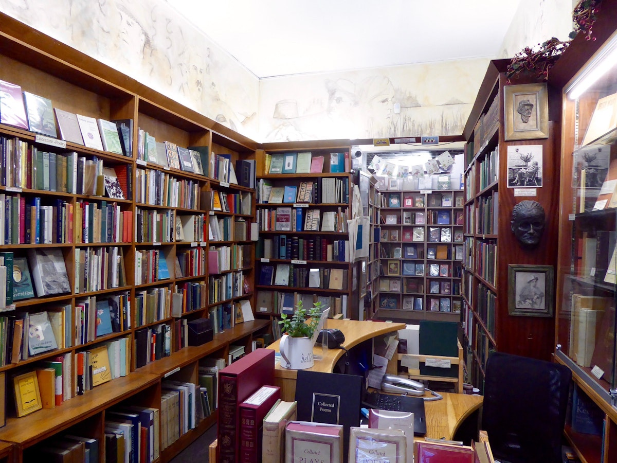 Shelves of rare books, including James Joyce's death mask in the corner