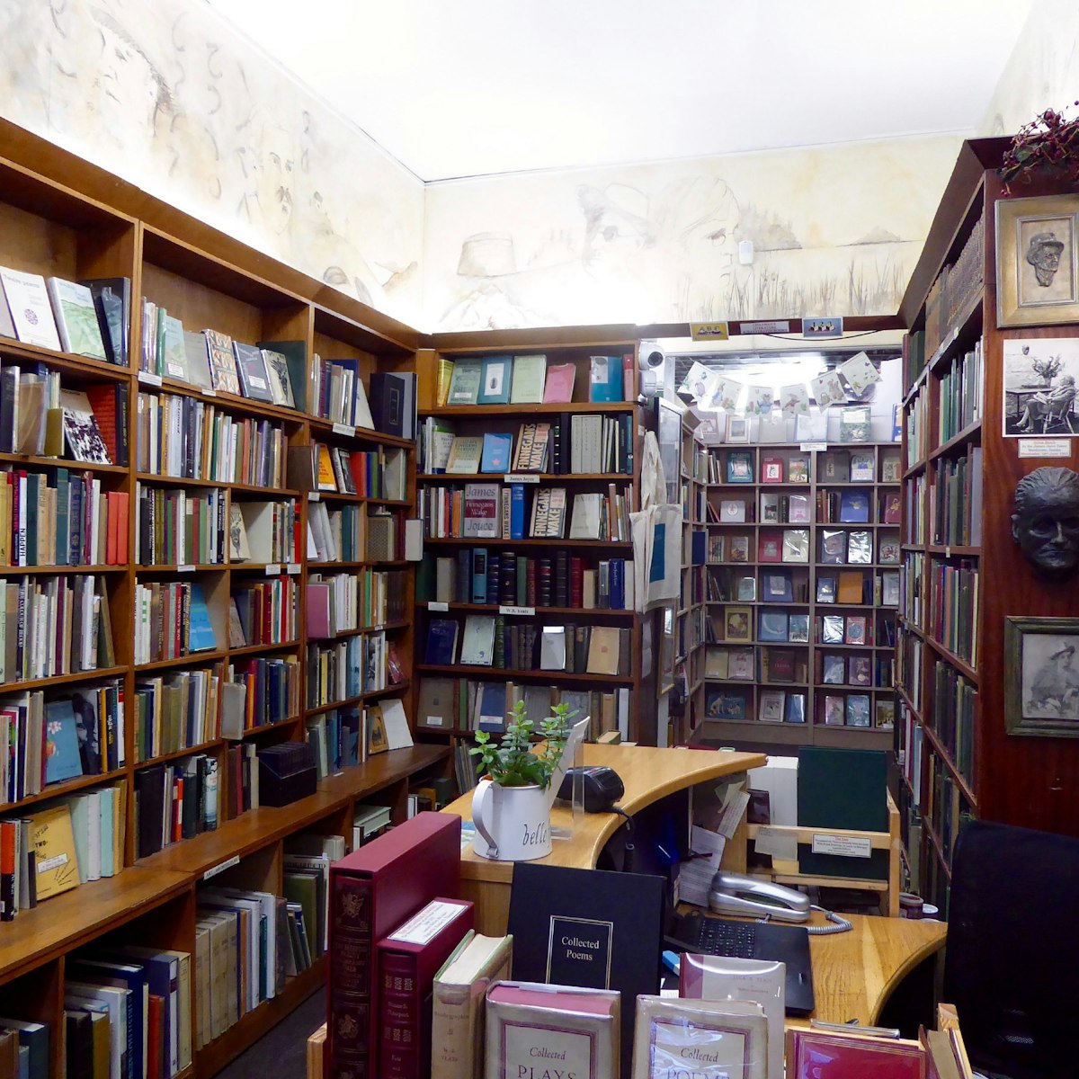 Shelves of rare books, including James Joyce's death mask in the corner