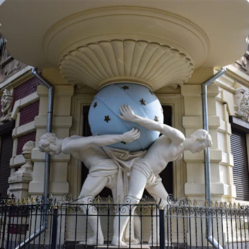 The two atlantes holding a sphere on the art nouveau facade of Falz-Fein House