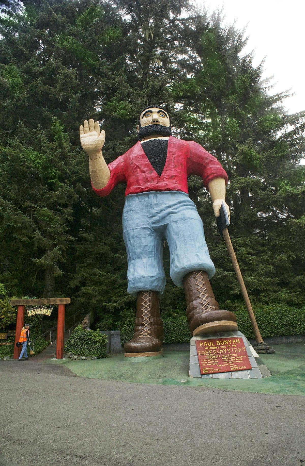 Paul Bunyan in parking lot at the Mystery of Trees. 42 feet tall. Woman at entrance gives a perspective to the size.