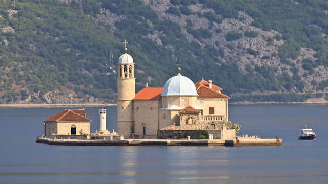 Gospa od Skrpjela (Our Lady of the Rocks) island, lit by early morning light, near Perast, Bay of Kotor, Montenegro