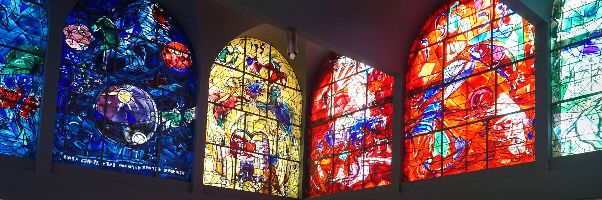 JERUSALEM - JANUARY 2017:  Hadassah Hospital's synagogue is decorated with Chagall's colorful stained glass windows depicting the tribes of Israel, as seen in Jerusalem circa 2017.; Shutterstock ID 569671492; Your name (First / Last): Lauren Keith; GL account no.: 65050; Netsuite department name: Online Editorial; Full Product or Project name including edition: Israel Update 2017