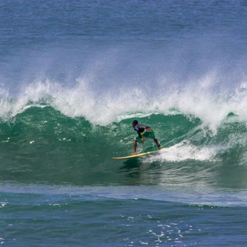 A surfer silhouette on the big waves of Santa Catalina surfing beaches. Panama, Central America; Shutterstock ID 635291543; Your name (First / Last): Alicia Johnson; GL account no.: 65050; Netsuite department name: Online Editorial ; Full Product or Project name including edition: Panama