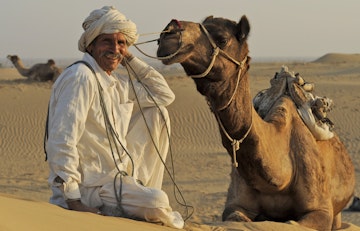 Portrait of man from Bishnoi Hindu sect with camel.