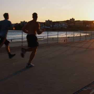 Joggers on promenade at Bondi Beach.