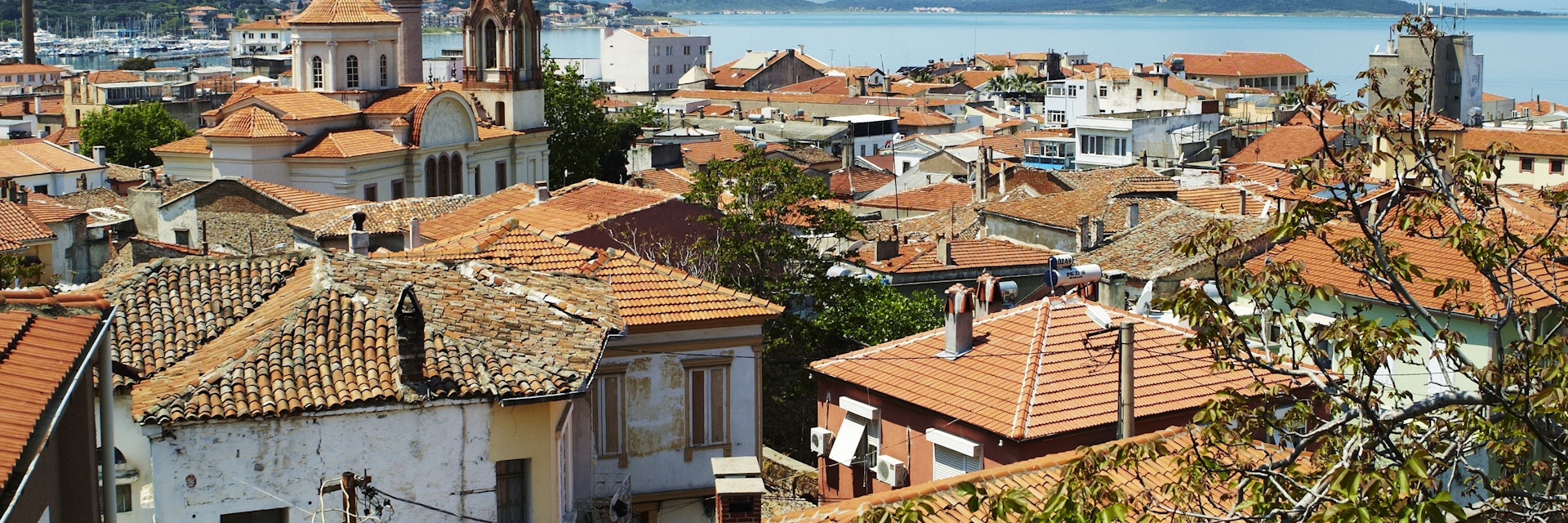 Terracotta rooftops of houses on Agean coast seen from Taksiyarhis Pension.