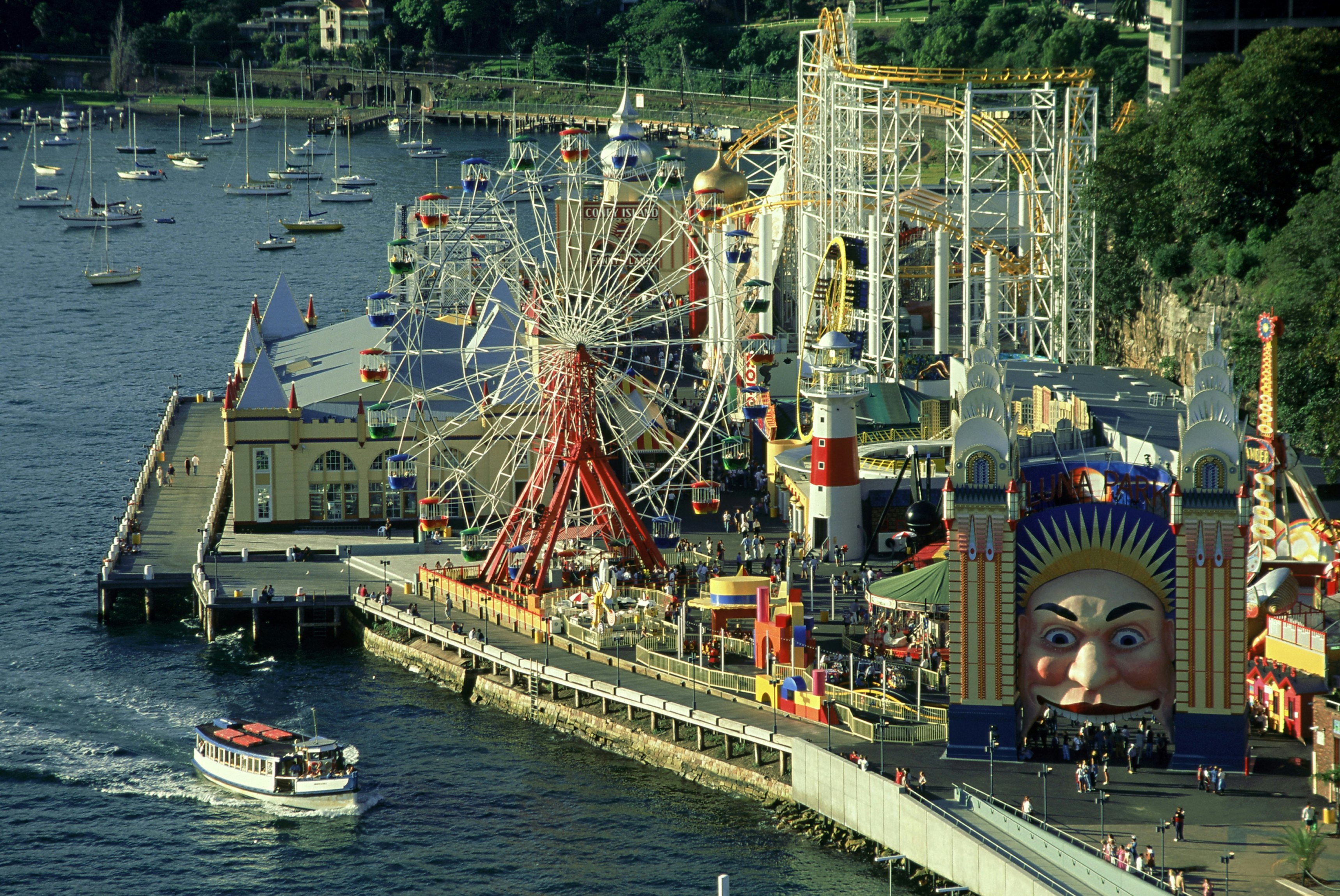 overview of luna park, ferry in foreground, milsons point, nsw
