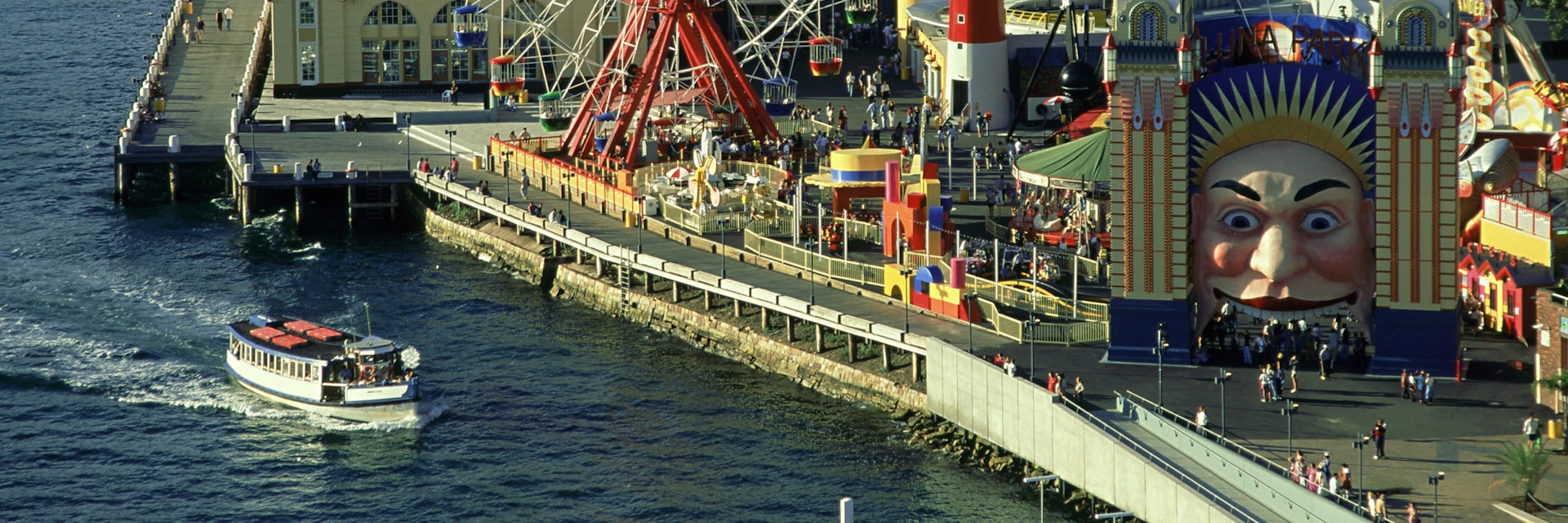 overview of luna park, ferry in foreground, milsons point, nsw