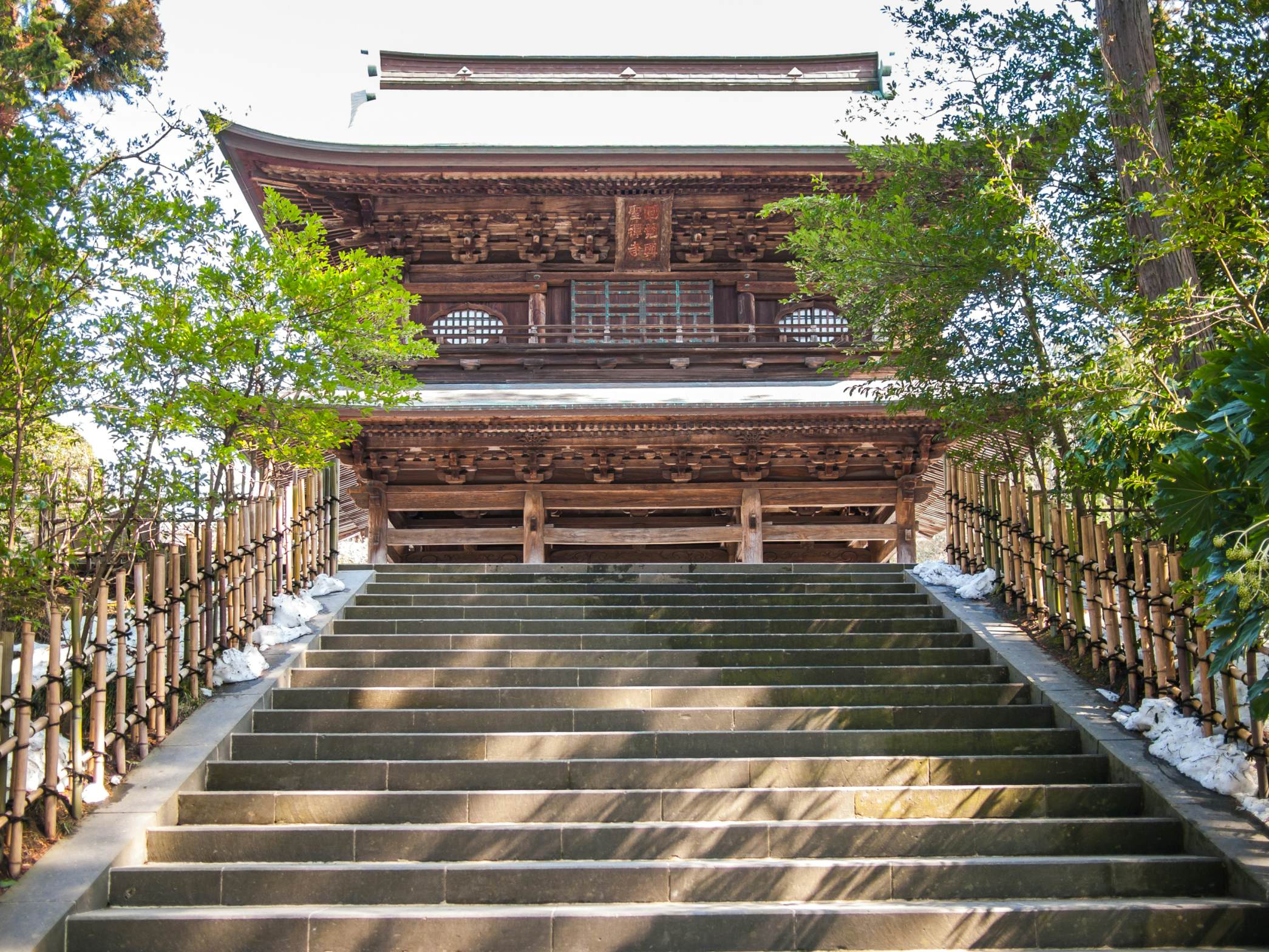 The incredible Engaku Ji entrance building build in wood in the city of Kamakura; Shutterstock ID 450122116; Your name (First / Last): Laura Crawford; GL account no.: 65050; Netsuite department name: Online Editorial; Full Product or Project name including edition: BiA: Takayama, south of Tokyo POI images for online