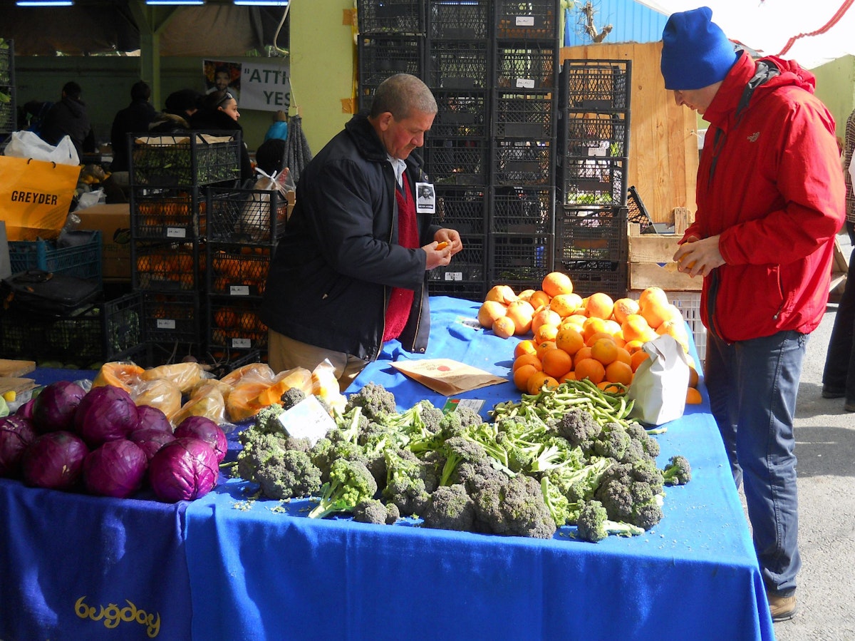 Buying from a vendor at the Feriköy Organic Market