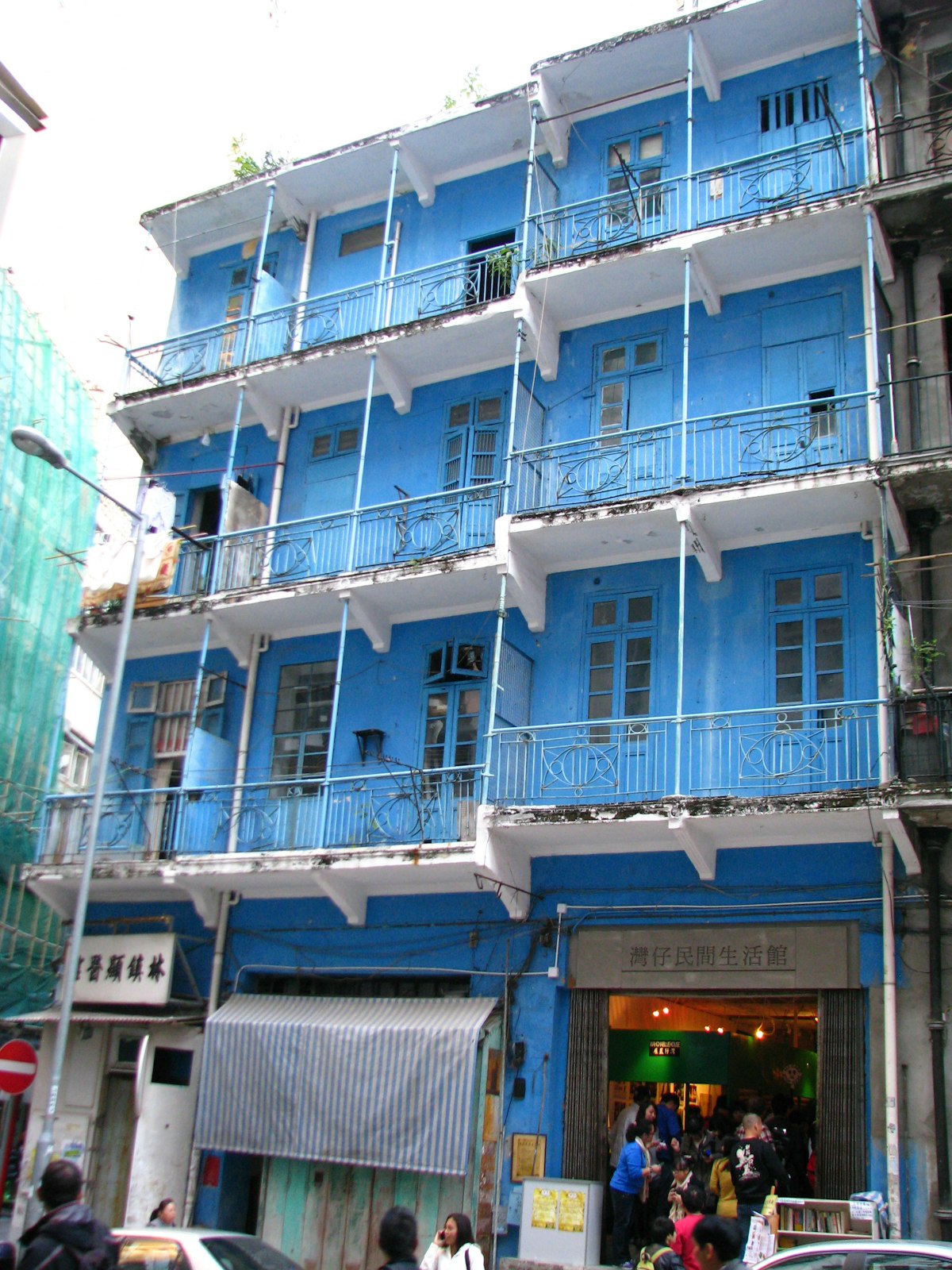 [UNVERIFIED CONTENT] Wan Chai traditional looking Blue House in Hong Kong...In this photo, an exhibit of the Hong Kong tram is being hosted to celebrate its 100th anniversary.