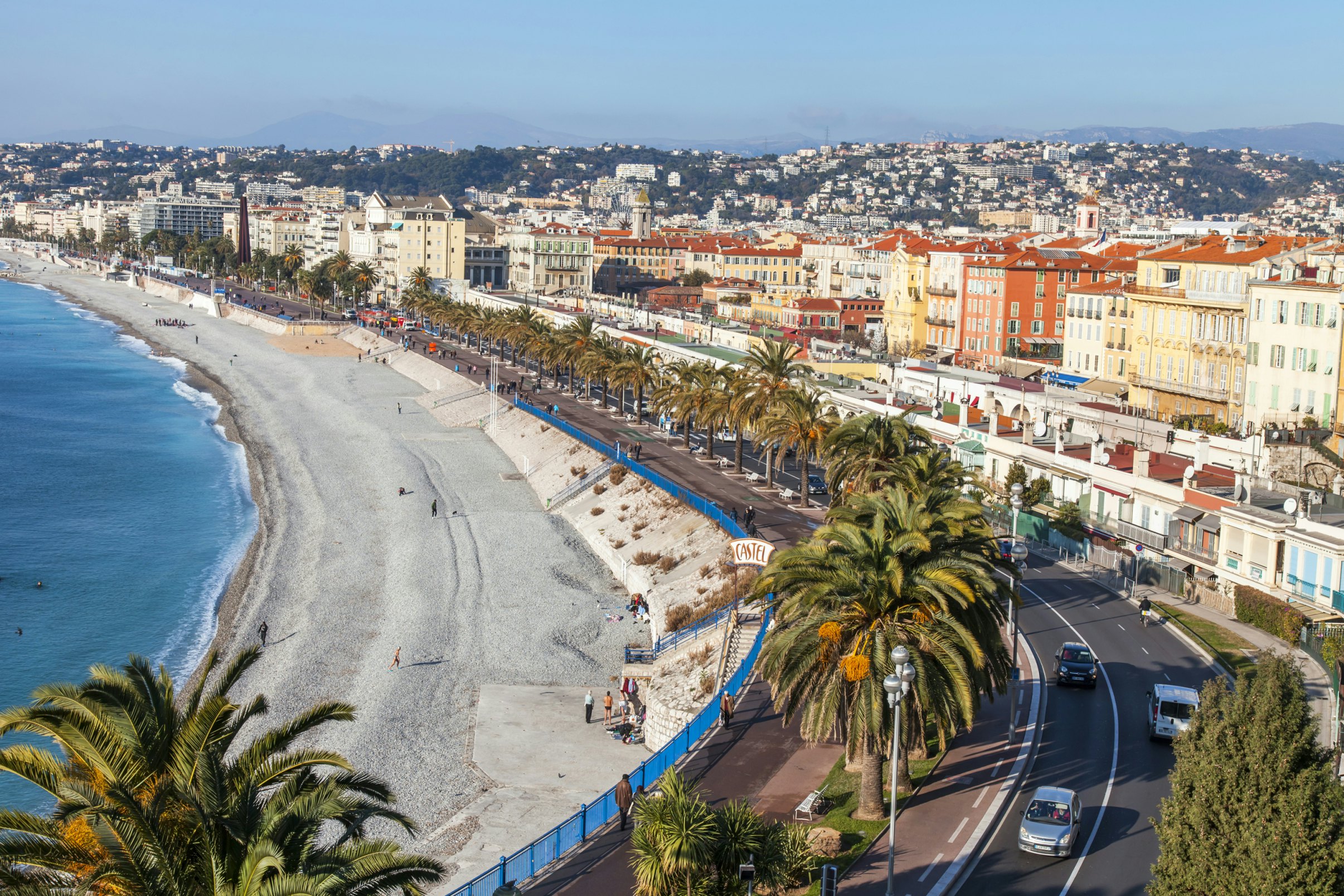 NICE, FRANCE, on JANUARY 9, 2017. Promenade des Anglais - the main embankment of the city, one of the most beautiful in the world, stretches along the sea and the beach. Aerial view from Shatto's hill; Shutterstock ID 613405820; Your name (First / Last): Daniel Fahey; GL account no.: 65050; Netsuite department name: Online Editorial; Full Product or Project name including edition: Nice and Graz POIs