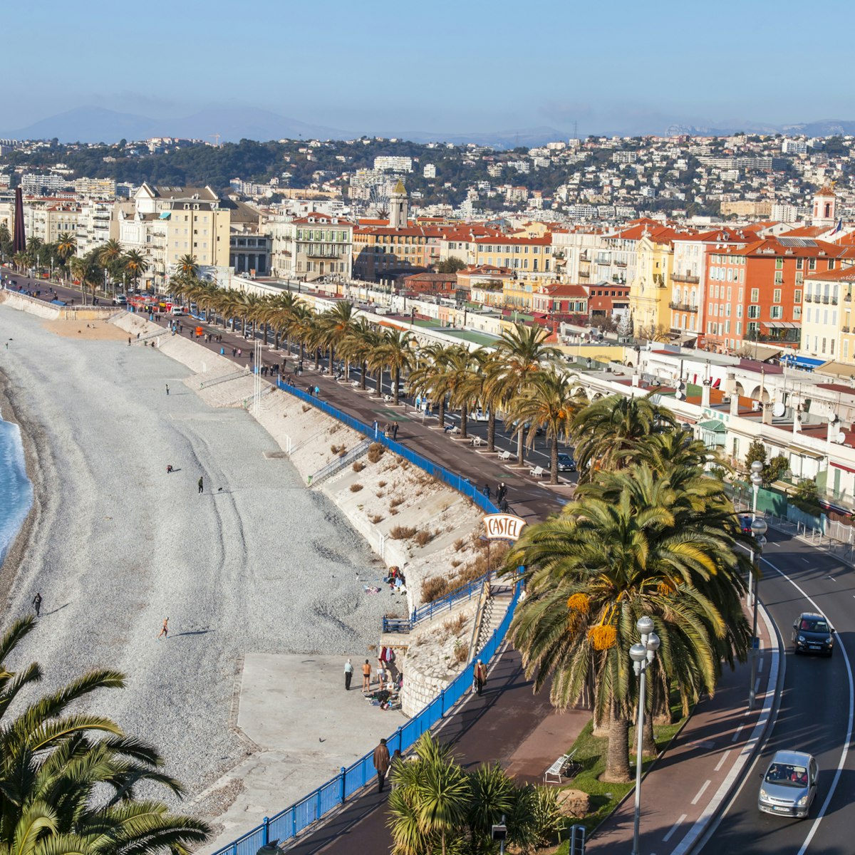 NICE, FRANCE, on JANUARY 9, 2017. Promenade des Anglais - the main embankment of the city, one of the most beautiful in the world, stretches along the sea and the beach. Aerial view from Shatto's hill; Shutterstock ID 613405820; Your name (First / Last): Daniel Fahey; GL account no.: 65050; Netsuite department name: Online Editorial; Full Product or Project name including edition: Nice and Graz POIs